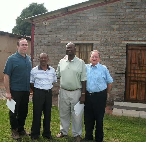 15-Pete-PatGodwin_Muncieville.jpg - Pete Samra with Pastor Moses, Pat Godwin in Muncieville Pat handles the preparation in getting the pastors a structure in South Africa.